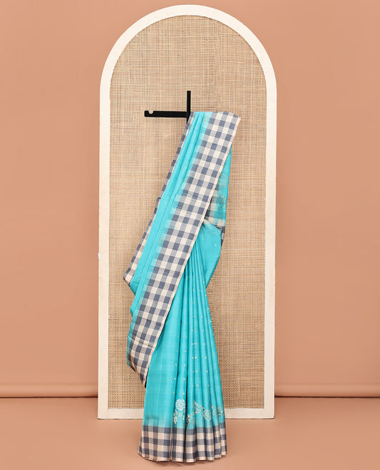 Blue Mayuri Soft Silk Saree, Steeped in Richness with Buttas and Floral Designs on Its Body, Complemented by Contrast Checked Border, Checked Pallu, and Paired with a Contrast Checked Blouse