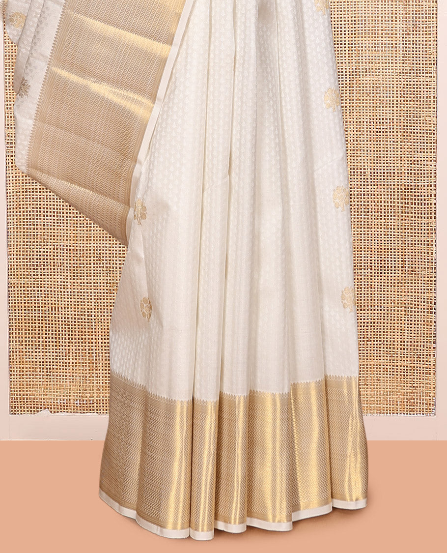 Cream Embossed Parambara Silk Saree, Enthralled with Zari Buttas, a Zari Border of Thilakam Mokku, and Vanki Designs, Grand Pallu, and Matching Blouse