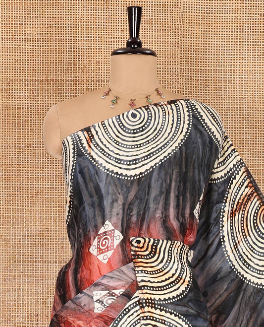 Borderless blue-maroon marble texture printed with batik block printed satin crepe saree, printed pallu, and a matching blouse of spiral motifs