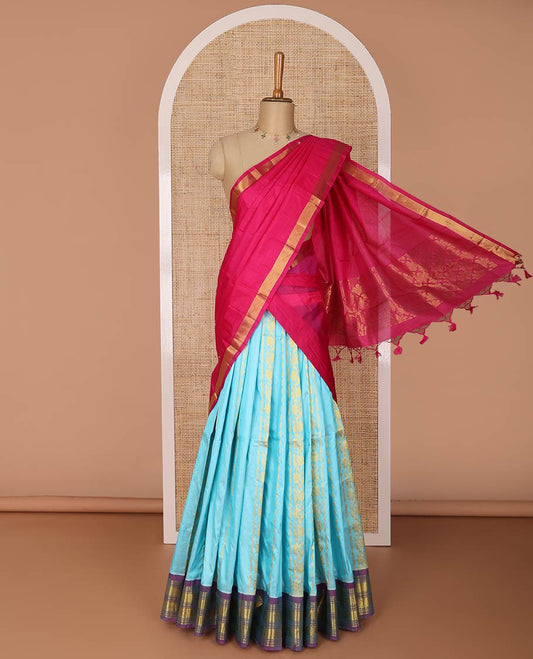 Blue floral design silk half saree with contrast border of rekku, banaras, poo chakram, zari design blouse & floral design dhavani