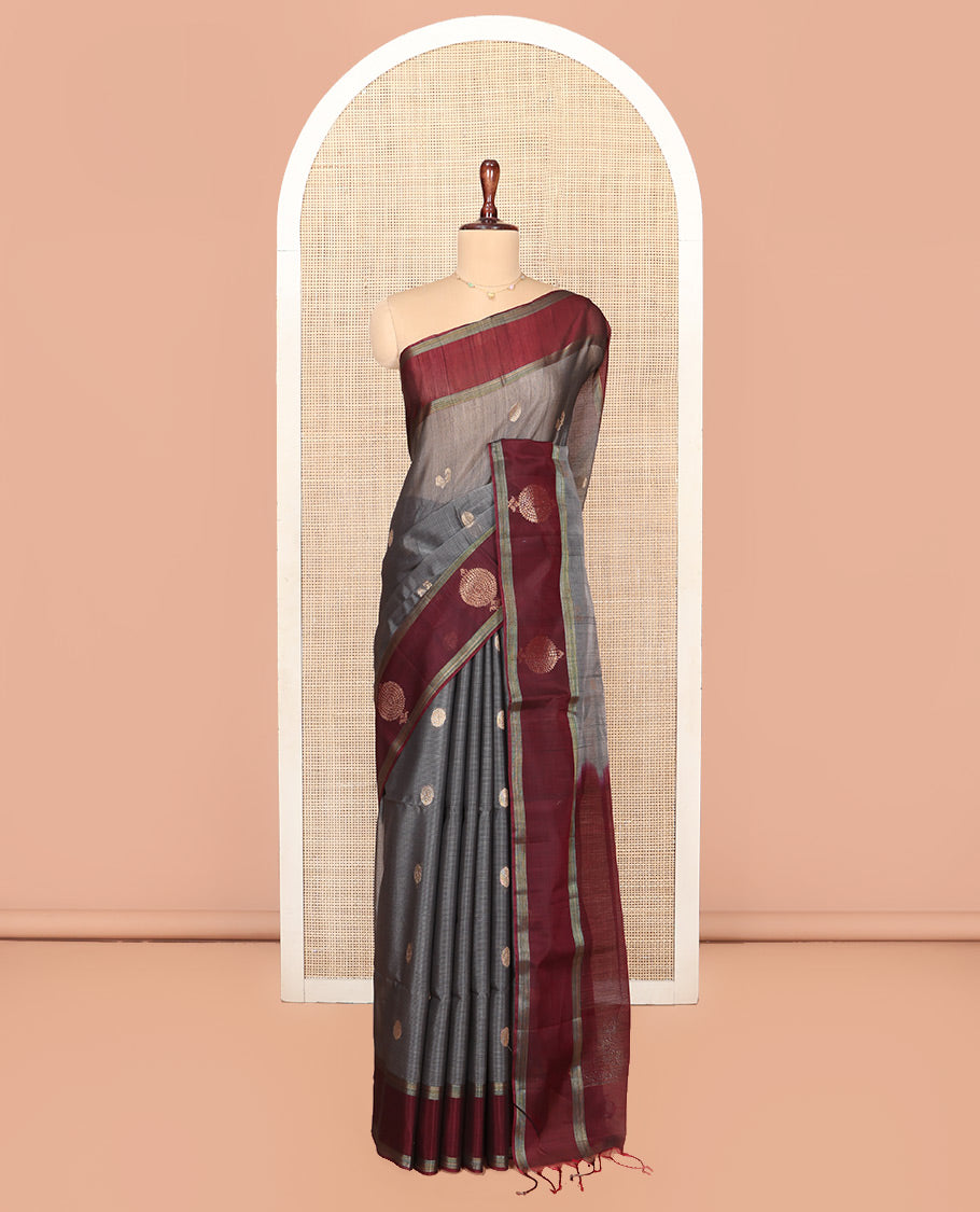 Grey Silk Cotton Saree, Artfully Woven with Peacock and Rudraksham Motifs On Its Body, Complemented by Contrast Zari Motifs Woven Border, Geometric Zari Patterned Pallu and Paired with a Contrast Blouse