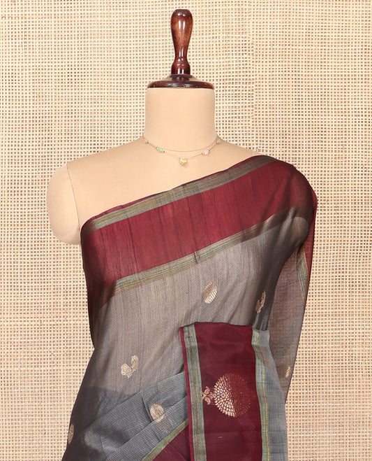 Grey Silk Cotton Saree, Artfully Woven with Peacock and Rudraksham Motifs On Its Body, Complemented by Contrast Zari Motifs Woven Border, Geometric Zari Patterned Pallu and Paired with a Contrast Blouse