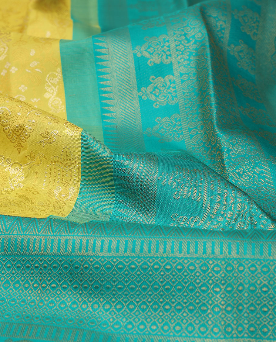 Yellow jacquard silk saree, contrast geometric patterned zari border & argyle patterned pallu