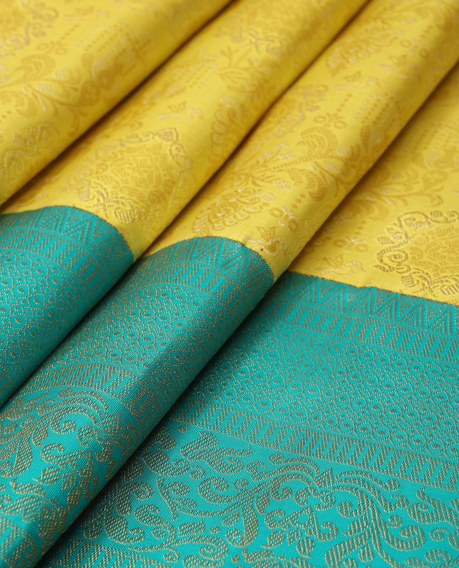 Yellow jacquard silk saree, contrast geometric patterned zari border & argyle patterned pallu