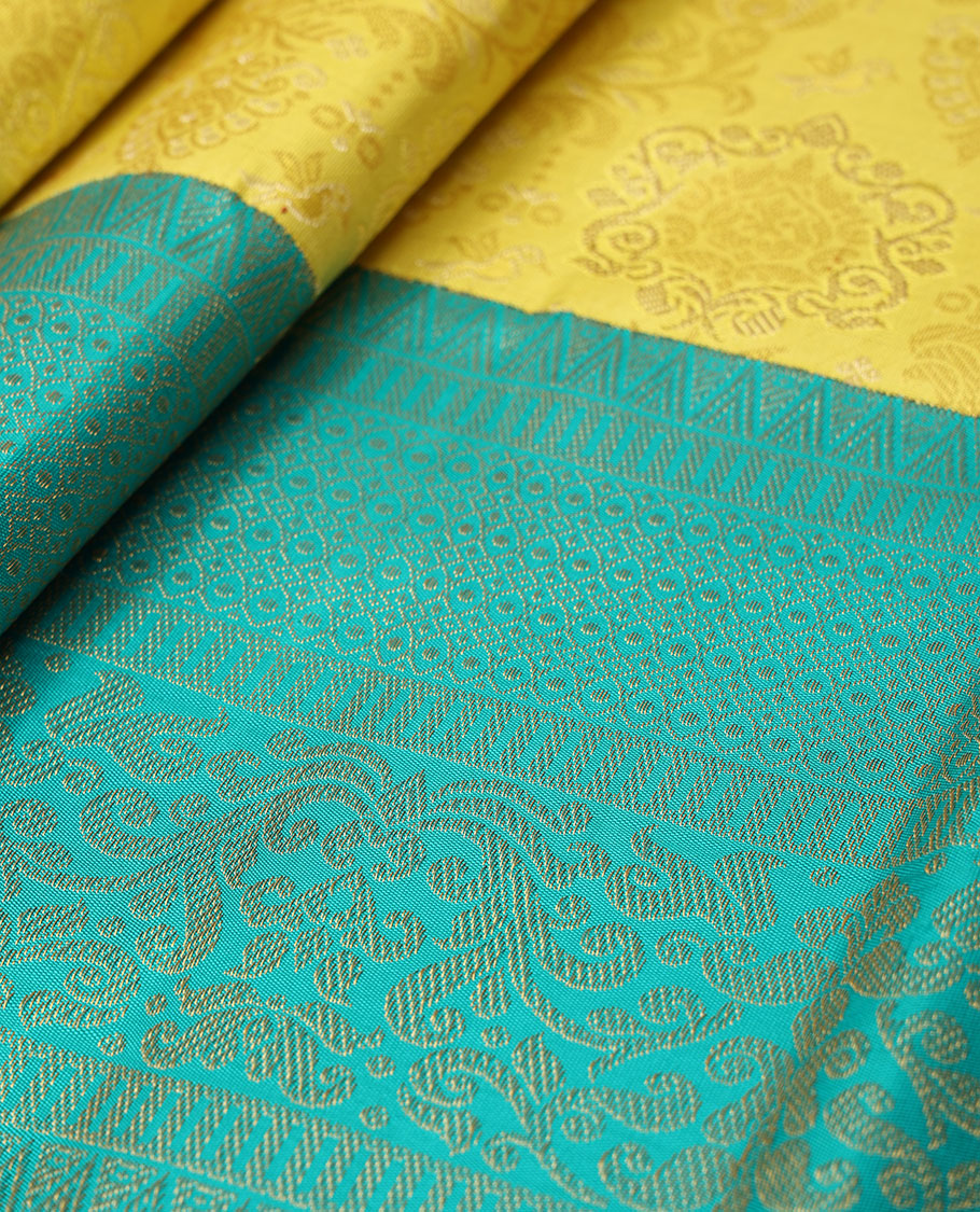 Yellow jacquard silk saree, contrast geometric patterned zari border & argyle patterned pallu