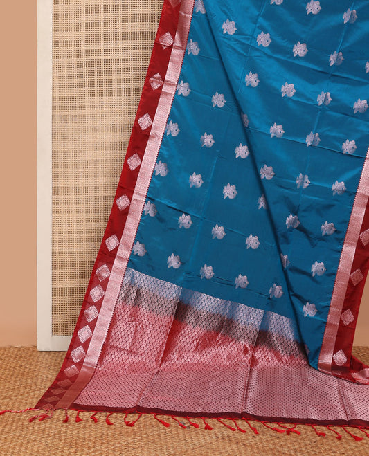 Blue semi-soft silk saree with zari buttas, contrast diamond design border & intricate pallu