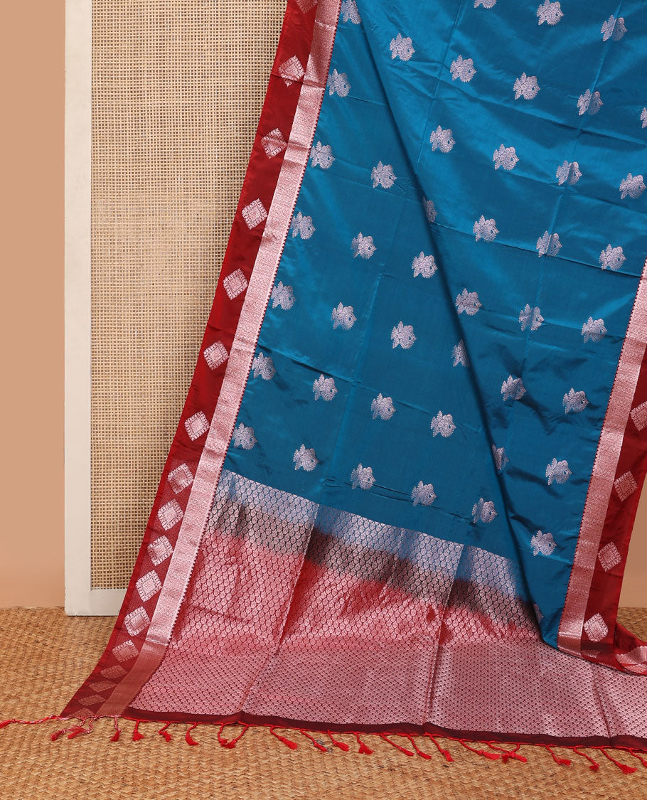 Blue semi-soft silk saree with zari buttas, contrast diamond design border & intricate pallu