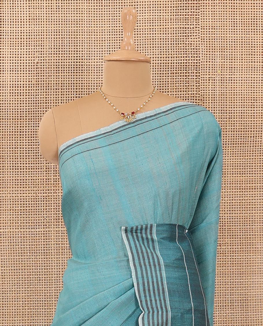 Blue heathered tussar silk saree, contrast striped border, and contrast striped pallu