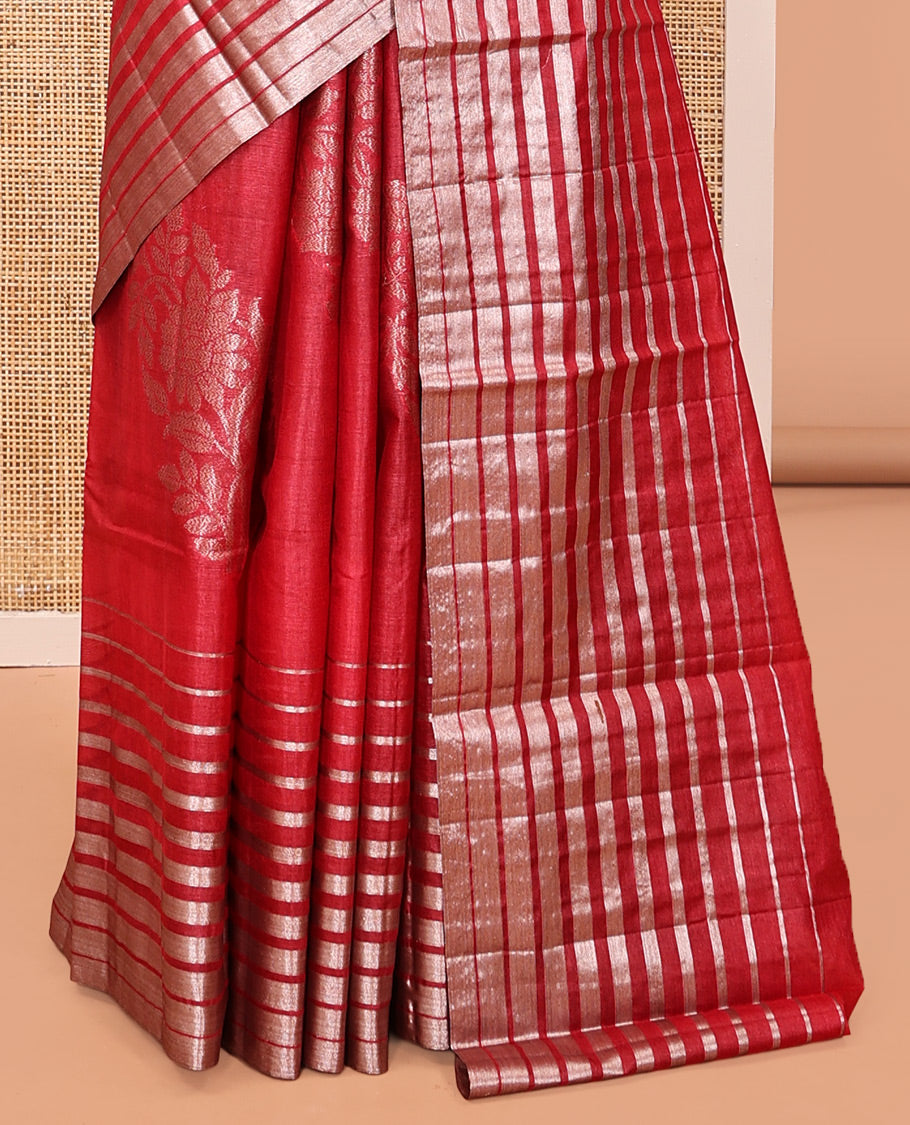 Borderless Red Tussar Silk Saree, Gracefully Embellished with Zari Stripes and Floral Buttas, Striped Pallu, and a Matching Blouse