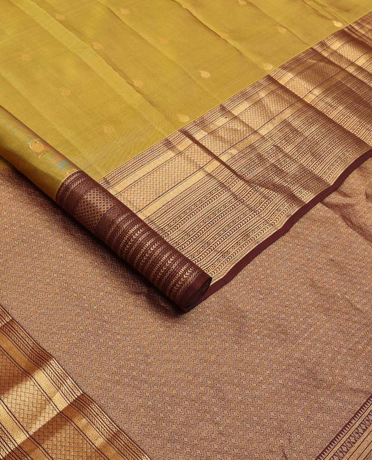 Green zari buttas Vasundhara silk mix saree, contrast border of vanki, jaal, mayil kann, banaras, kathir, and zari designs, and jaal pallu