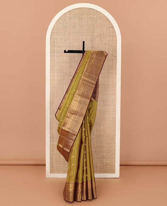 Green zari buttas Vasundhara silk mix saree, contrast border of vanki, jaal, mayil kann, banaras, kathir, and zari designs, and jaal pallu