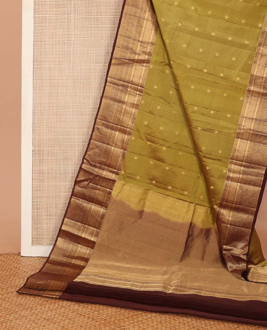 Green zari buttas Vasundhara silk mix saree, contrast border of vanki, jaal, mayil kann, banaras, kathir, and zari designs, and jaal pallu