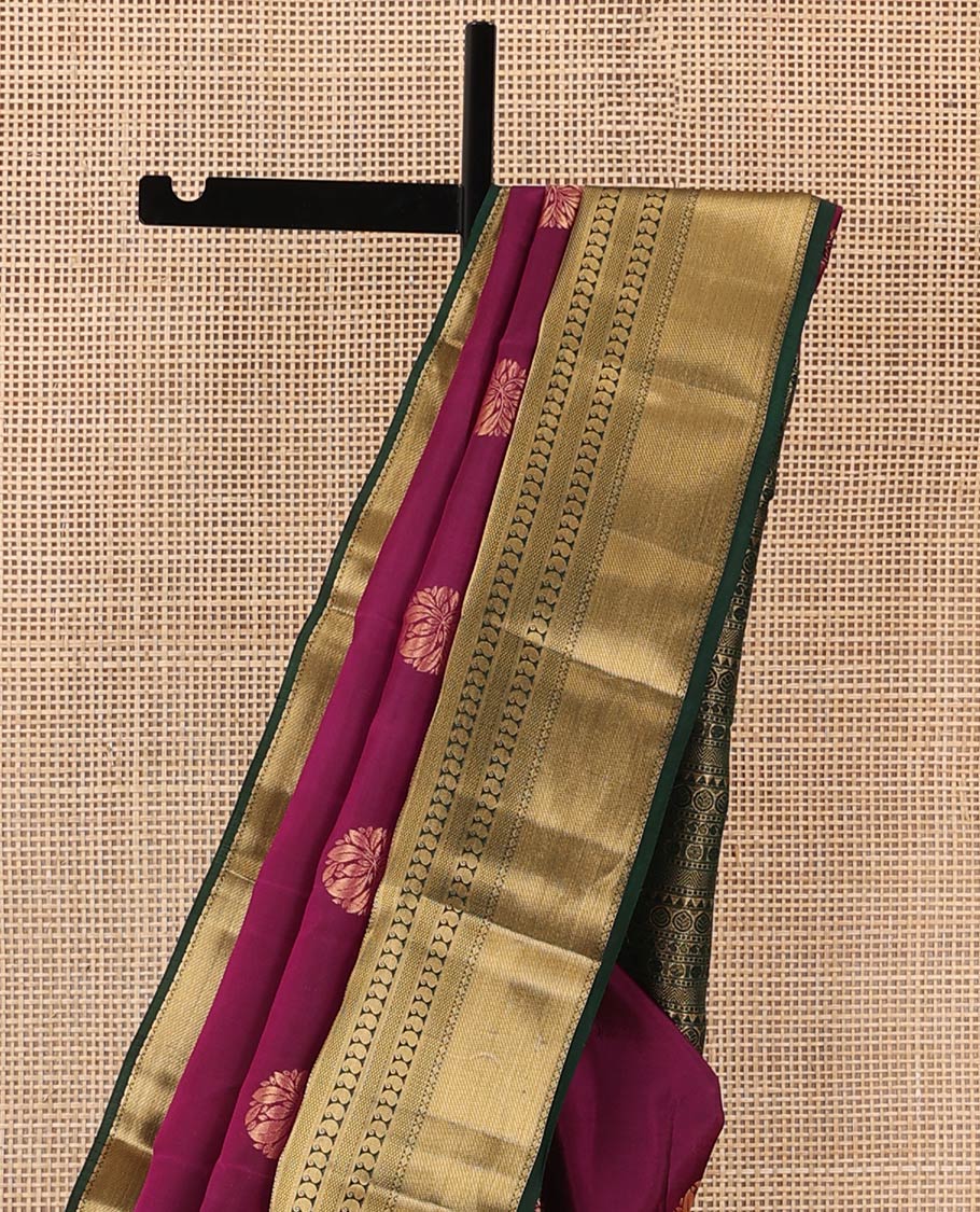 Magenta zari buttas Vasundhara silk mix saree, contrast border of thilakam, mayil kann, diamond, and manga designs, and geometric patterned pallu