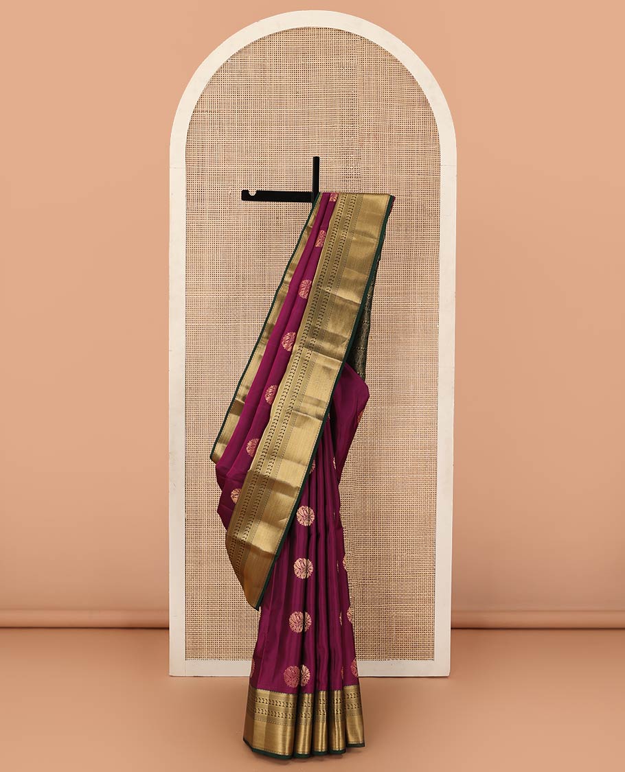 Magenta zari buttas Vasundhara silk mix saree, contrast border of thilakam, mayil kann, diamond, and manga designs, and geometric patterned pallu