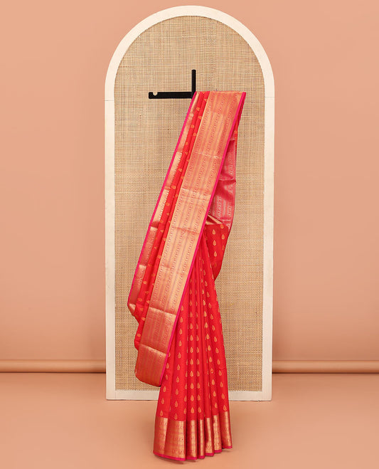 Red Vasundhara Lite Silk Mix Saree Embellished with Zari Buttas, Featuring a Contrast Border with Rekku, Neli, Manga, and Mayil Designs, with the Pallu Mirroring the Same Border Motifs, Paired with a Contrast Blouse