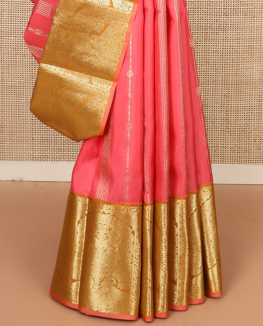 Pink zari design silk saree, contrast tree of life-style motifs woven border of peacocks, and zari-rich jaal pallu