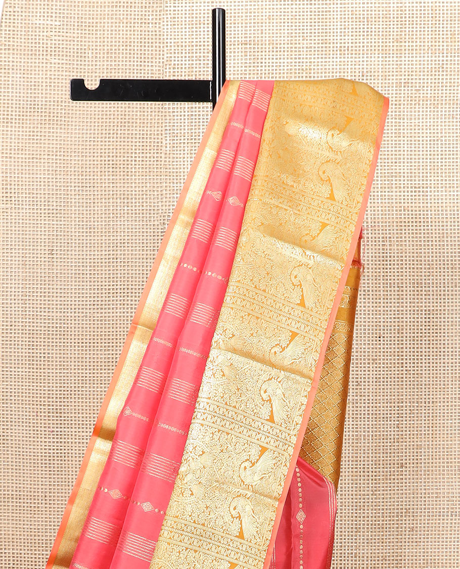 Pink zari design silk saree, contrast tree of life-style motifs woven border of peacocks, and zari-rich jaal pallu