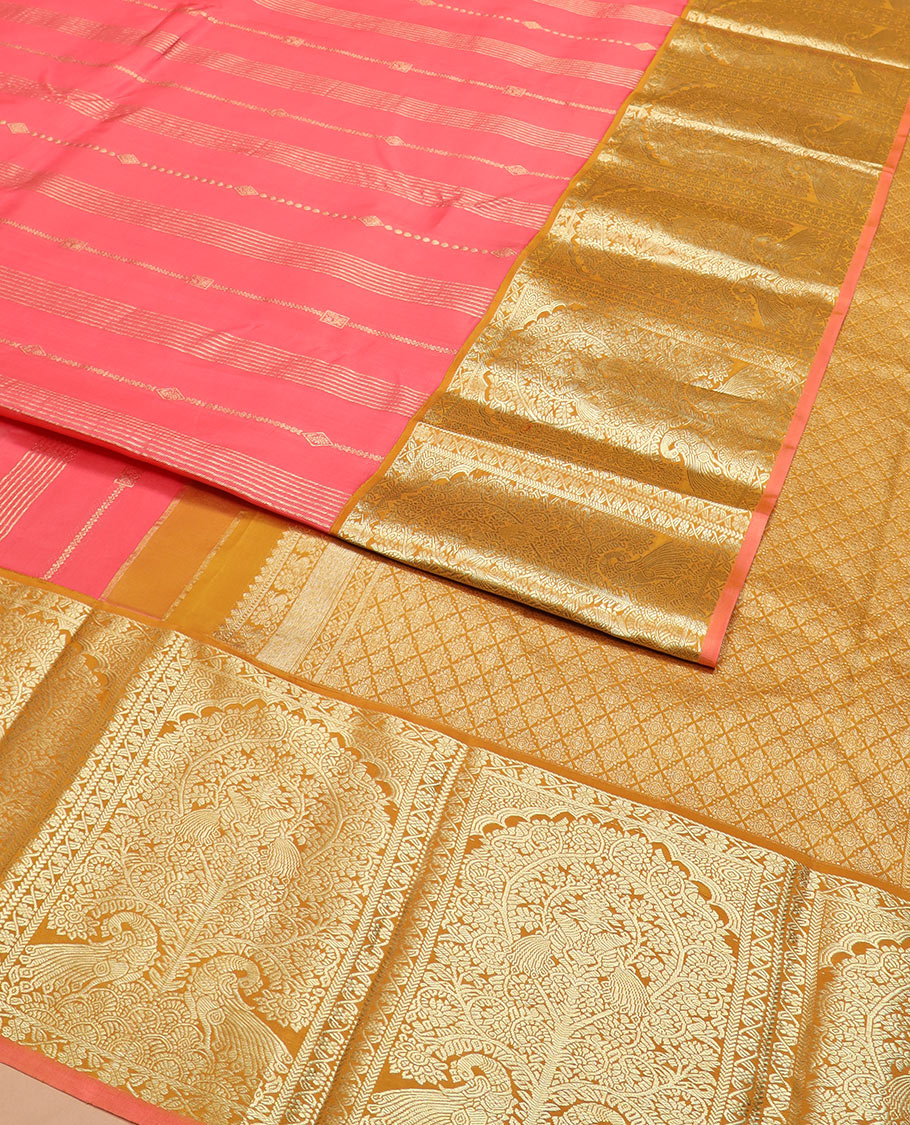 Pink zari design silk saree, contrast tree of life-style motifs woven border of peacocks, and zari-rich jaal pallu