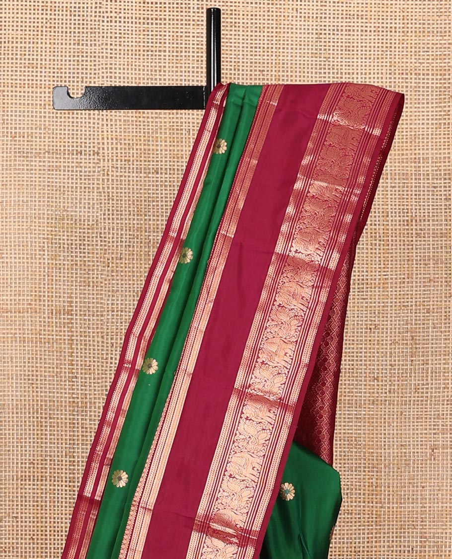 Green kamalam meena buttas silksaree, contrast rettai pettu border of thilakam,neli,mayil kann & puli nagam & intricate pallu