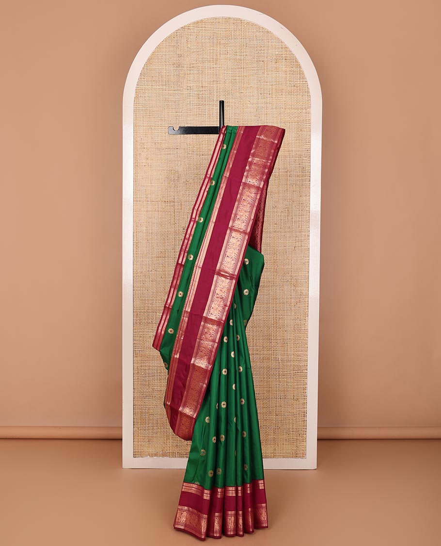 Green kamalam meena buttas silksaree, contrast rettai pettu border of thilakam,neli,mayil kann & puli nagam & intricate pallu