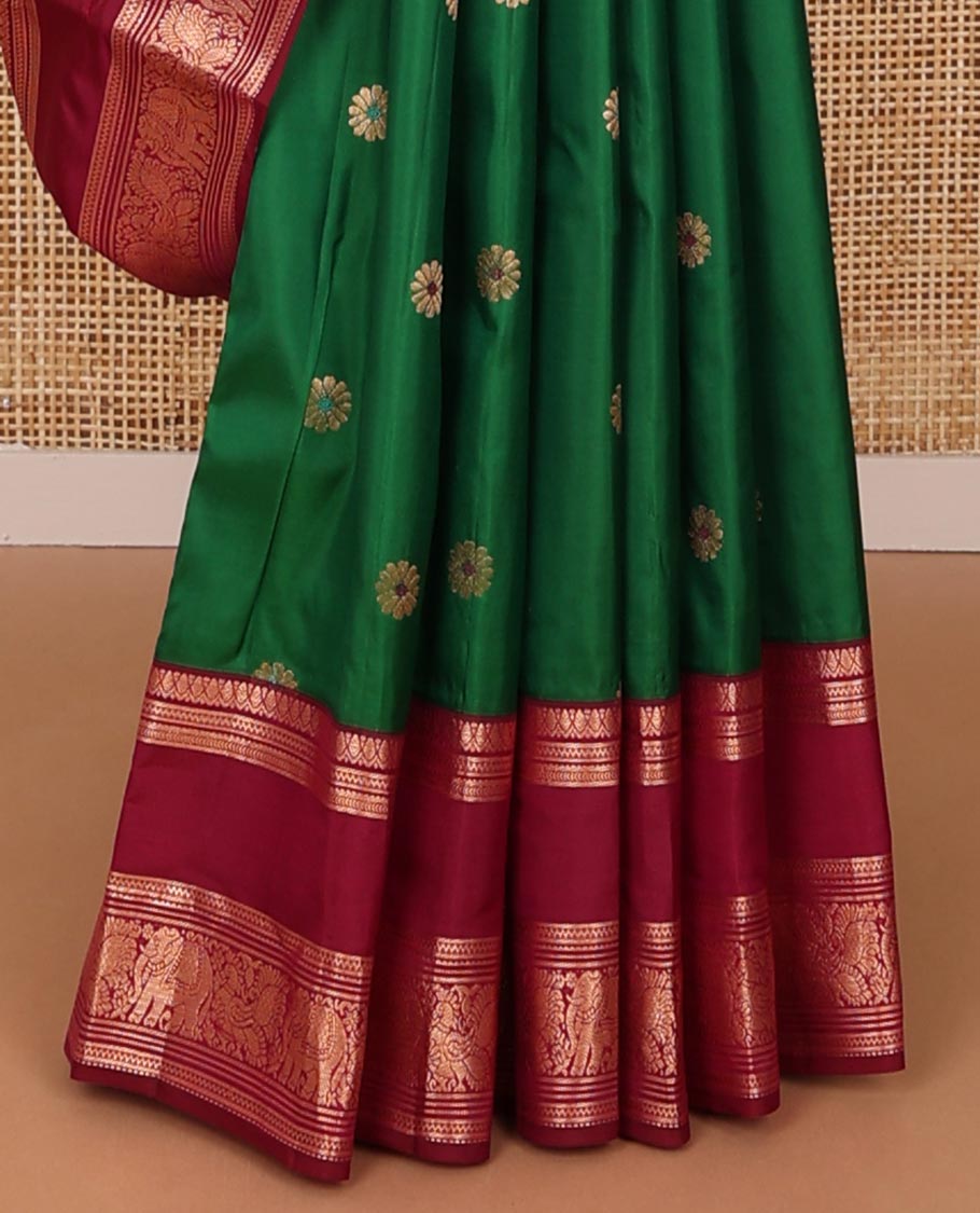 Green kamalam meena buttas silksaree, contrast rettai pettu border of thilakam,neli,mayil kann & puli nagam & intricate pallu
