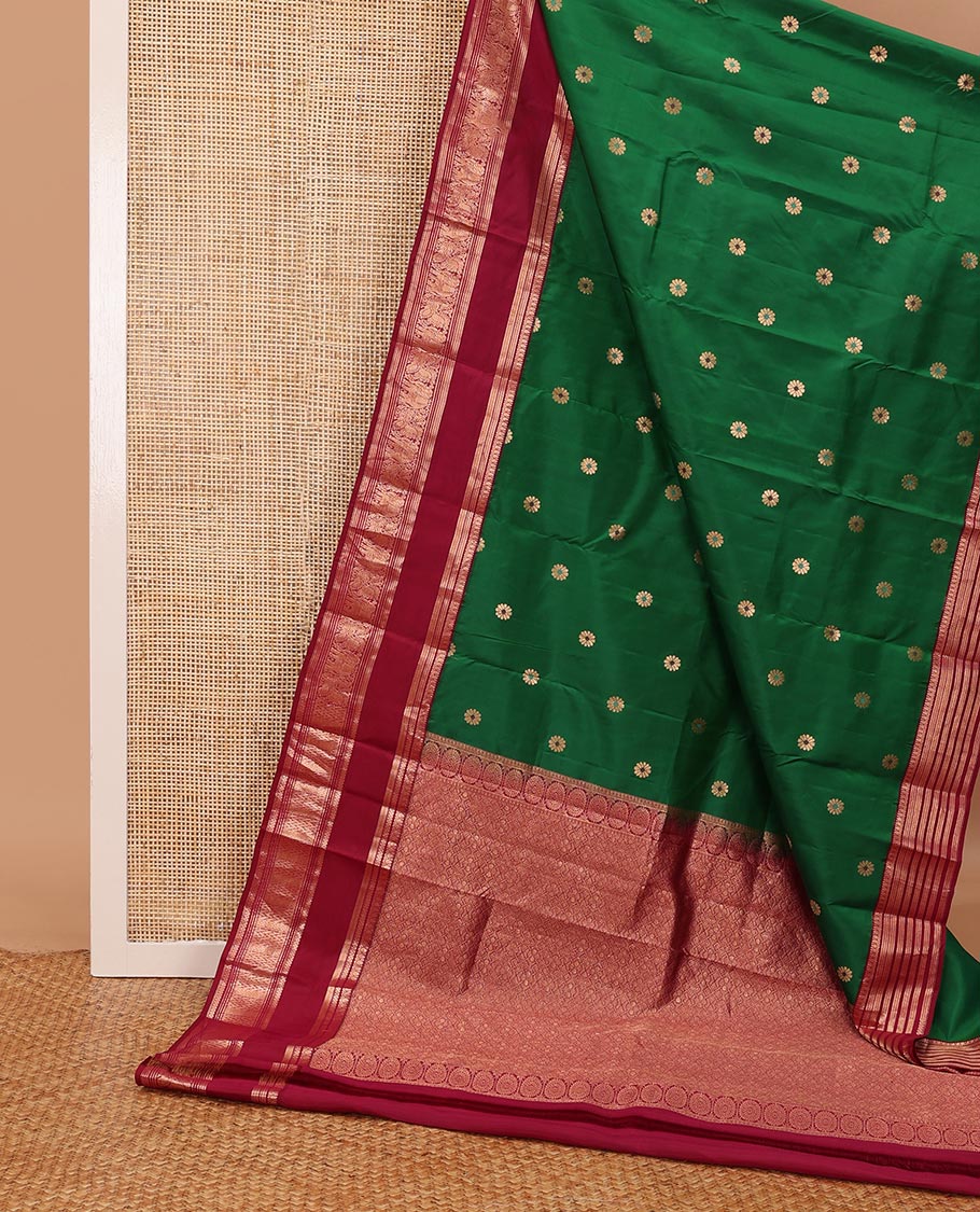 Green kamalam meena buttas silksaree, contrast rettai pettu border of thilakam,neli,mayil kann & puli nagam & intricate pallu