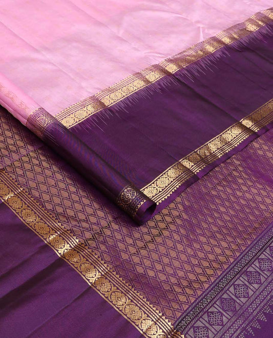 Pink buttas Kanchipuram silk saree, contrast border of rekku, banaras, muthu, and laddu kamalam, and jaal pallu