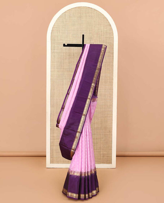 Pink buttas Kanchipuram silk saree, contrast border of rekku, banaras, muthu, and laddu kamalam, and jaal pallu