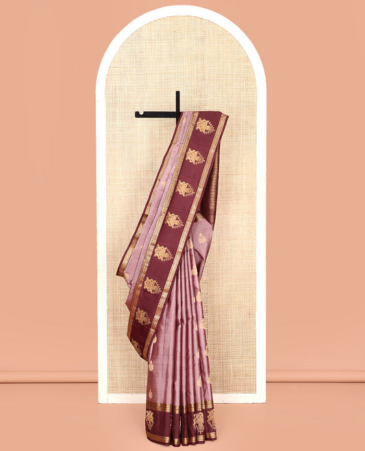 Pale Brown Vasundhara Silk Saree, Finely Crafted with Zari Buttas All Over Its Body, Complemented by Contrast Border of Thilakam Mokku, Neli, Kili, Yaanai, and Ara Maadam Designs, Grand Pallu and Paired with a Contrast Blouse