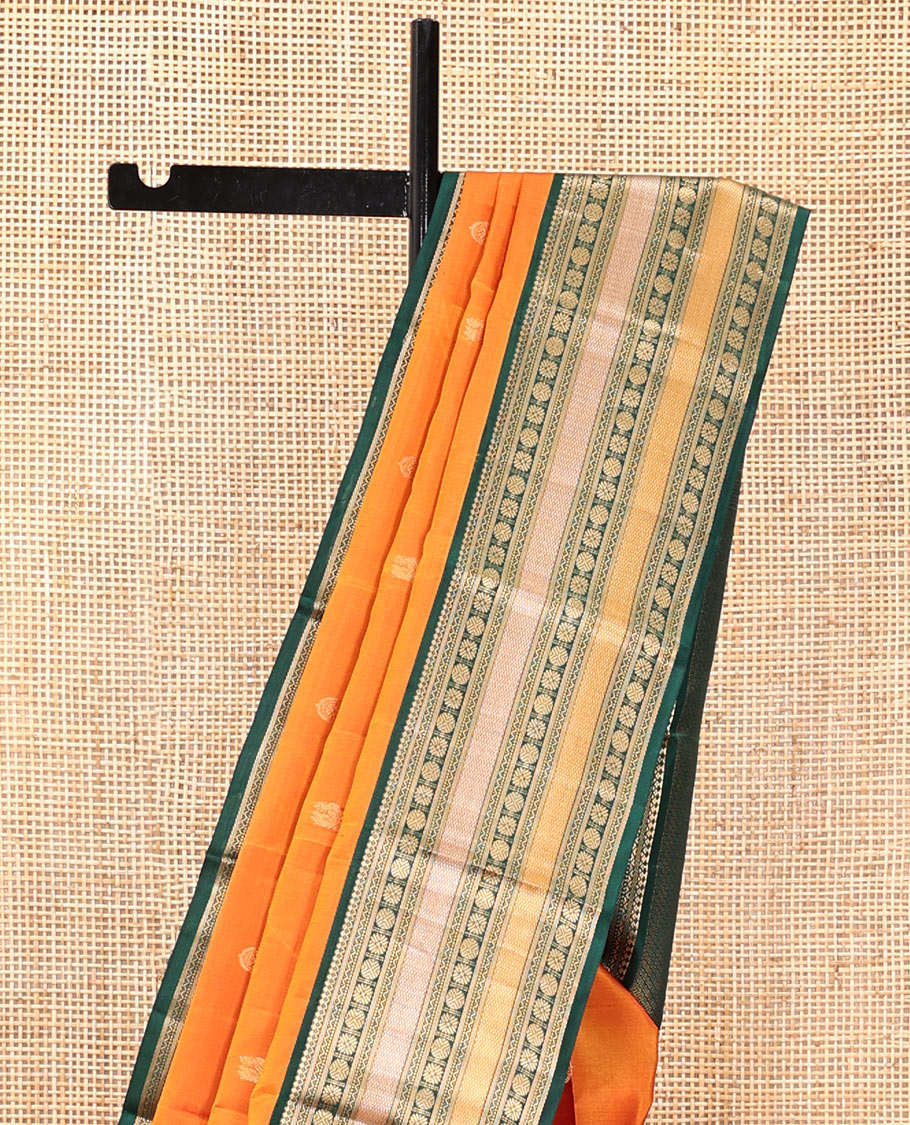 Orange Vasundhara Silk Saree, Woven with Zari Buttas, Contrast Border of Thilakam Mokku, Neli, Muthu, Kuyil Kann, Rudraksham, and Star Vanki, Grand Pallu, and a Contrast Blouse