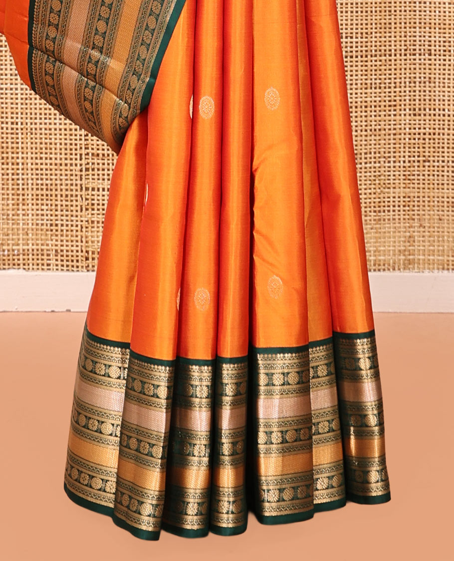 Orange Vasundhara Silk Saree, Woven with Zari Buttas, Contrast Border of Thilakam Mokku, Neli, Muthu, Kuyil Kann, Rudraksham, and Star Vanki, Grand Pallu, and a Contrast Blouse