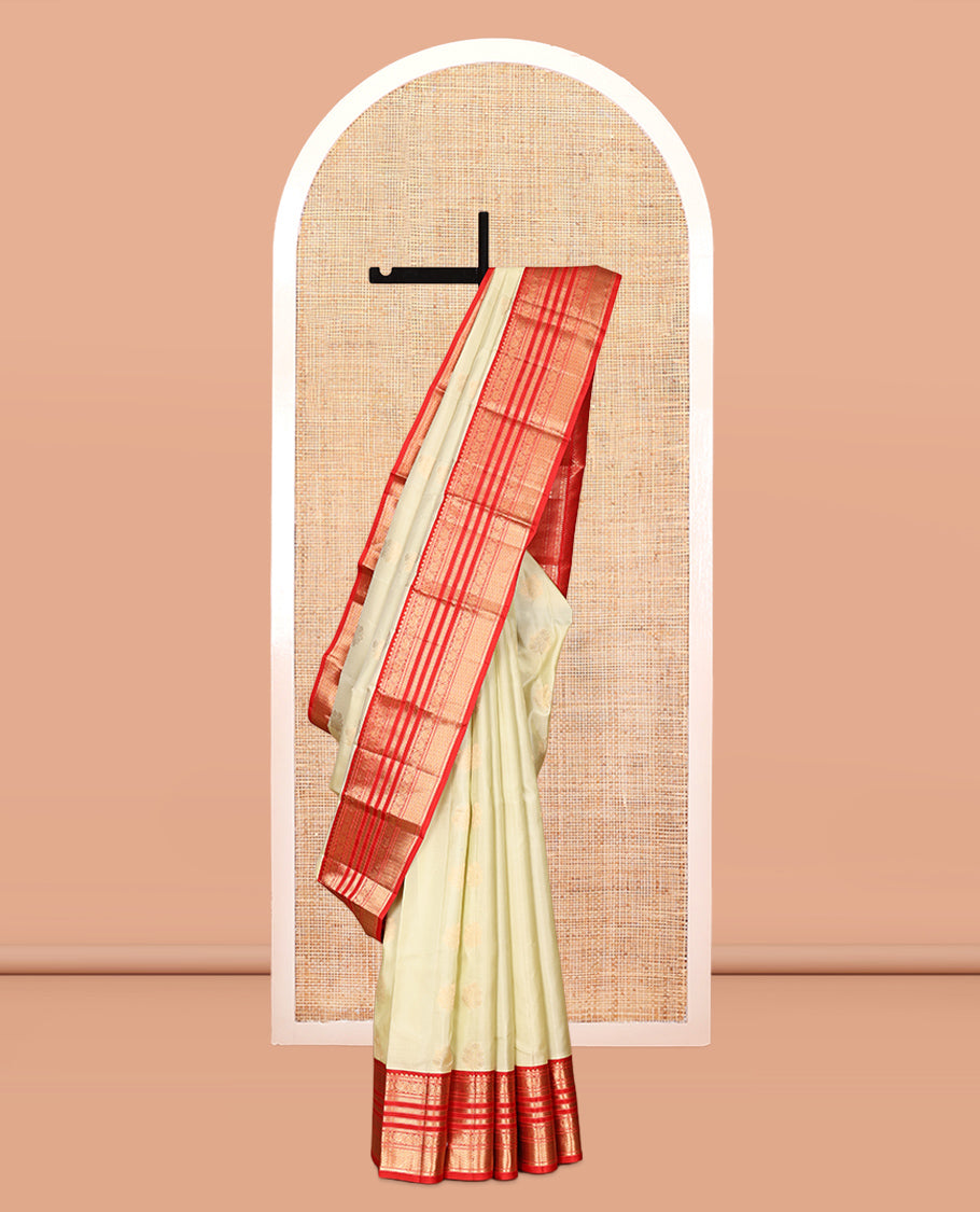 Pale Green Vasundhara Silk Saree,Sparsely Woven with Zari Buttas, Contrast Border of Thilakam Mokku, Kodi Visiry, Muthu, Mayil Kann, Mayil, and Kodi Visiry, Grand Pallu, and Contrast Blouse