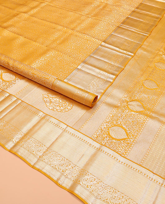 Yellow jacquard kanchipuram silk saree, traditional zari border, and pallu of intricate floral designs