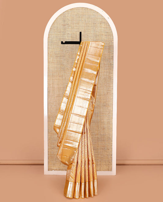 Yellow jacquard kanchipuram silk saree, traditional zari border, and pallu of intricate floral designs