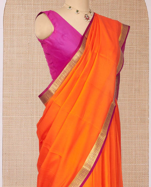 Orange Plain Mysore Silk Saree, Complemented by a Contrast Traditional Zari Design Border, Zari Striped Pallu, and Paired with a Contrast Blouse