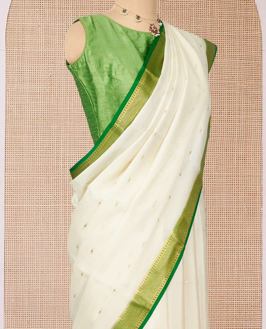 White Mysore Silk Saree, Ornamented with Zari Buttas All Over Its Body, Complemented by a Contrast Traditional Zari Design Border, Zari-Buttas Woven Pallu, and Paired with a Contrast Blouse