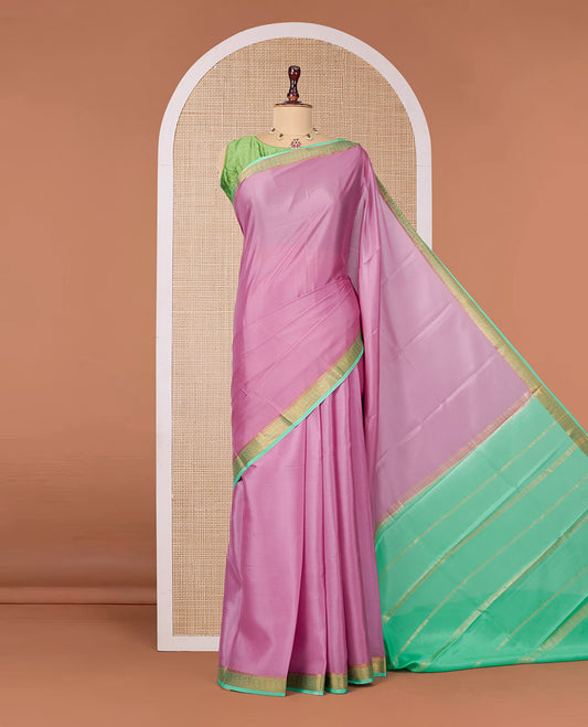Onion Pink Plain Mysore Silk Saree, Complemented by a Contrast Traditional Zari Design Border, Zari Striped Pallu, and Paired with a Contrast Blouse