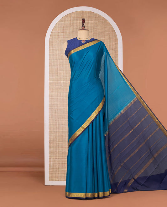 Peacock Blue Plain Mysore Silk Saree, Complemented by a Contrast Traditional Zari Design Border, Zari Striped Pallu, and Paired with a Contrast Blouse