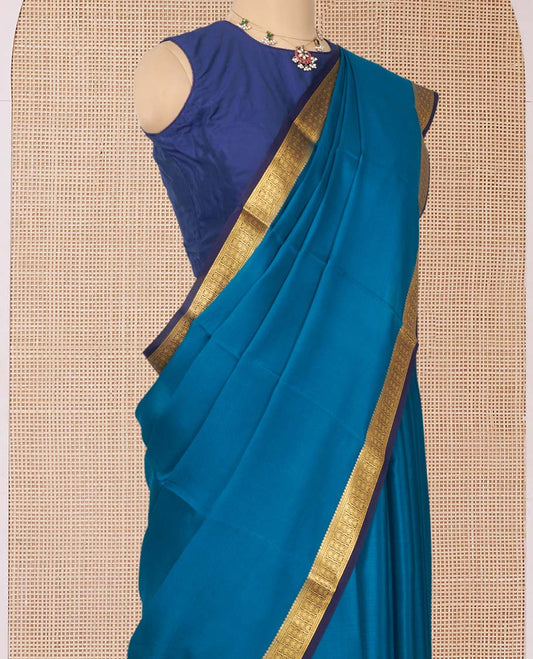 Peacock Blue Plain Mysore Silk Saree, Complemented by a Contrast Traditional Zari Design Border, Zari Striped Pallu, and Paired with a Contrast Blouse