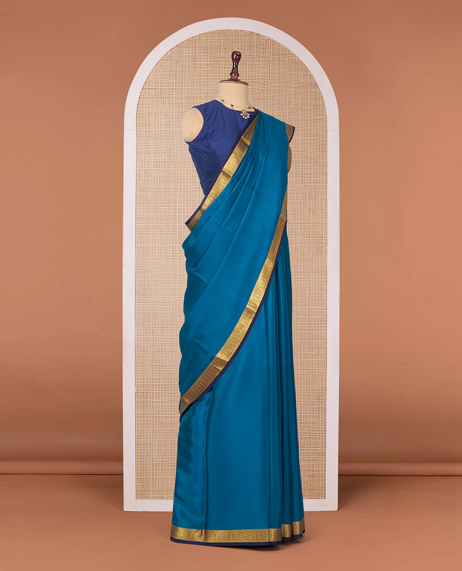 Peacock Blue Plain Mysore Silk Saree, Complemented by a Contrast Traditional Zari Design Border, Zari Striped Pallu, and Paired with a Contrast Blouse