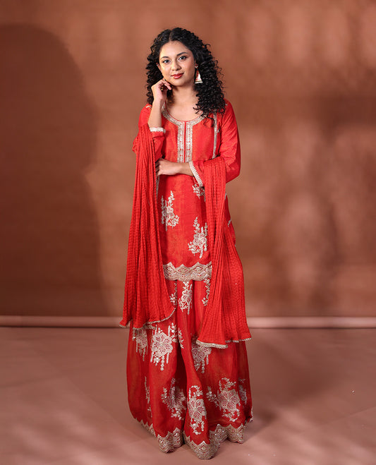 Red Readymade Suit Featuring an Intricately Embroidered Round Neck 3/4th Sleeve Straight-Cut Top, Floral-Embroidered Scallop-Cut Sharara Pants, and a Crushed Dupatta