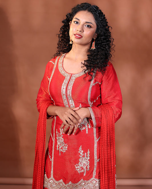 Red Readymade Suit Featuring an Intricately Embroidered Round Neck 3/4th Sleeve Straight-Cut Top, Floral-Embroidered Scallop-Cut Sharara Pants, and a Crushed Dupatta