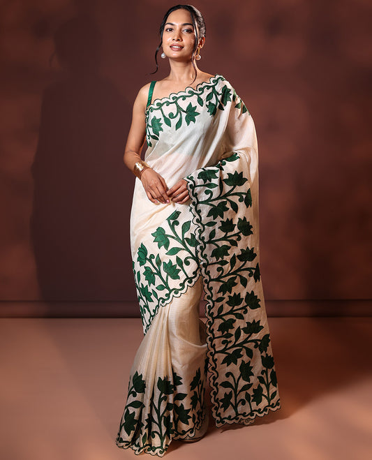 Cream and Green Plain Fancy Kota Silk Saree Highlighted with Lotus Floral Applique Embroidered Scallop Border, Lotus Motifs Applique Embroidered Pallu, and a Contrast Plain Blouse