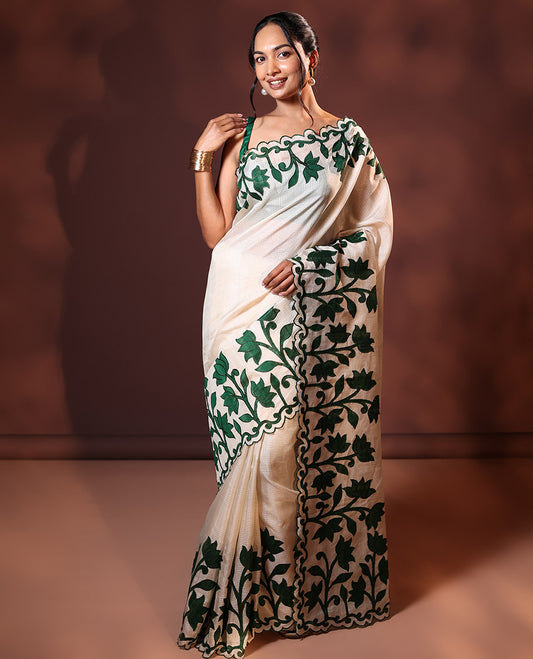 Cream and Green Plain Fancy Kota Silk Saree Highlighted with Lotus Floral Applique Embroidered Scallop Border, Lotus Motifs Applique Embroidered Pallu, and a Contrast Plain Blouse