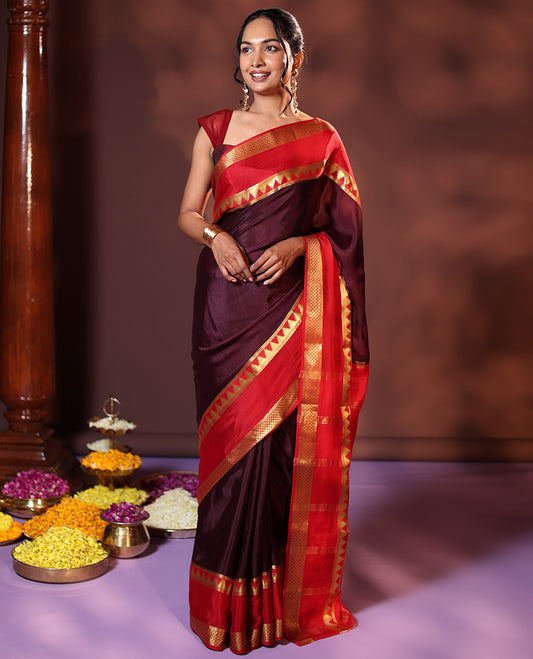 Brown Plain Silk Saree, Complemented by Captivating Contrast Rettai Pettu Border Featuring Thazampoo Rekku, and Jaal Designs, Pallu Adorned with Zari Stripes, and Paired with a Contrast Blouse
