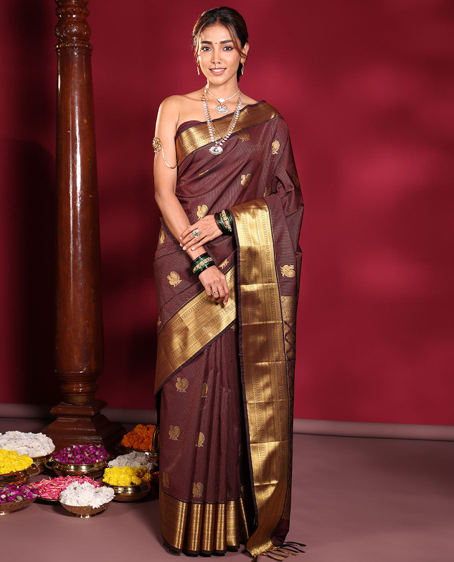 Chocolate Brown Budget Silk Saree, Elevated with Muthu Stripes, and Peacock Buttas on Its Body, Highlighted by a Traditional Zari Design Border, Pallu Delicately Woven with Floral Jaal Designs, and Paired with a Matching Blouse