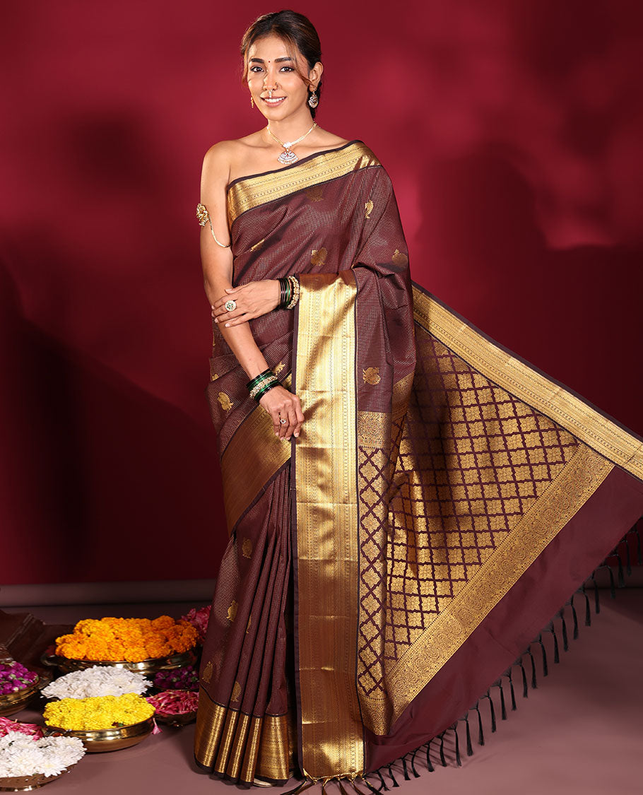 Chocolate Brown Budget Silk Saree, Elevated with Muthu Stripes, and Peacock Buttas on Its Body, Highlighted by a Traditional Zari Design Border, Pallu Delicately Woven with Floral Jaal Designs, and Paired with a Matching Blouse