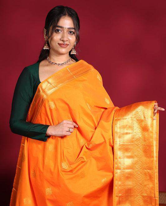Orange Budget Silk Saree, Enthralled with Zari Buttas on Its Body, Highlighted by a Traditional Zari Design Border, Grandly Jaal-Patterned Pallu, and Paired with a Matching Blouse