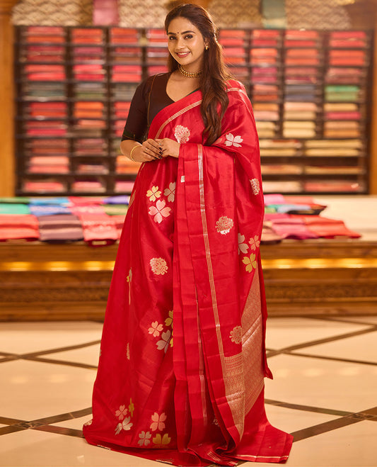 Red four-petal flower & floral-vase zari buttas raw mango silk saree, zari striped self-border & intricately zari woven pallu