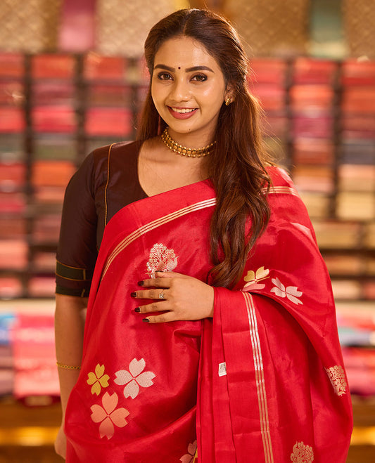 Red four-petal flower & floral-vase zari buttas raw mango silk saree, zari striped self-border & intricately zari woven pallu